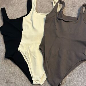 3 OQQ bodysuits